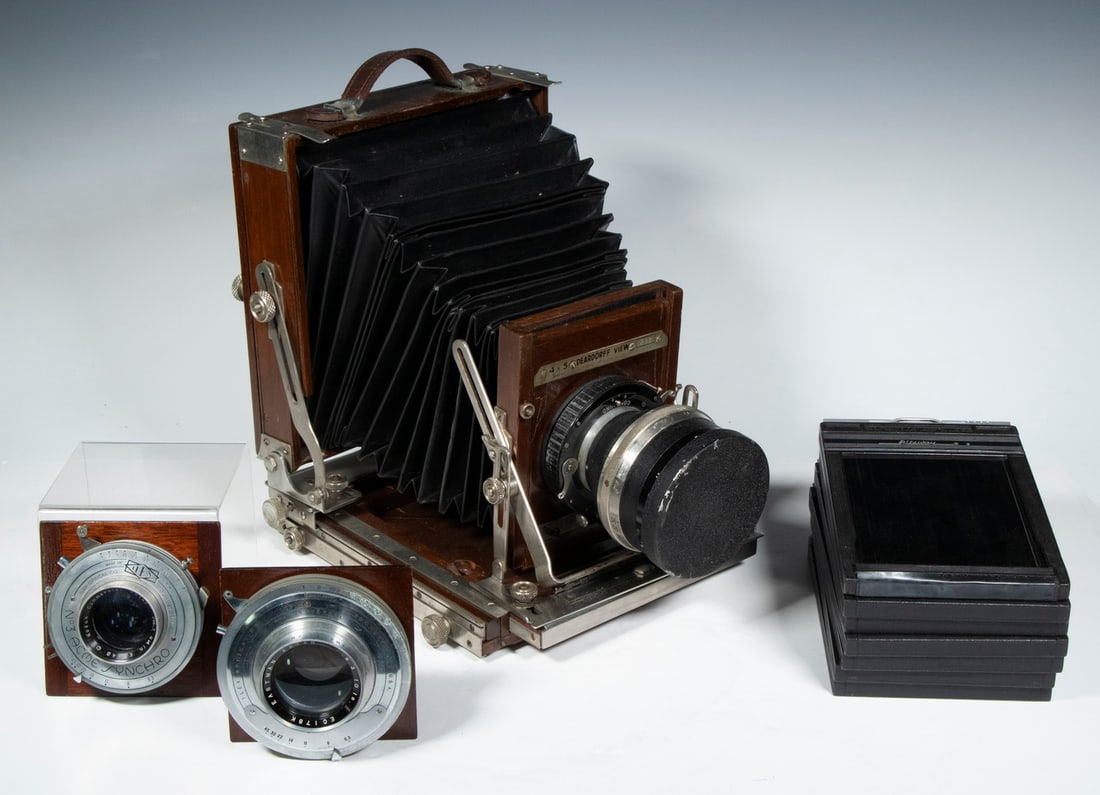 DEARDORFF STUDIO CAMERA W/ (3) LENSES & FILM PACKS: L.F. Deardorff & Sons 4x5 Special view camera with leather bellows, s/n 238, with Hugo & Meyer Co. Tele Magor lens 1:5.5=40 cm s/n 995558, in fine condition, including: Eastman Ektar lens f:6.3 10in,