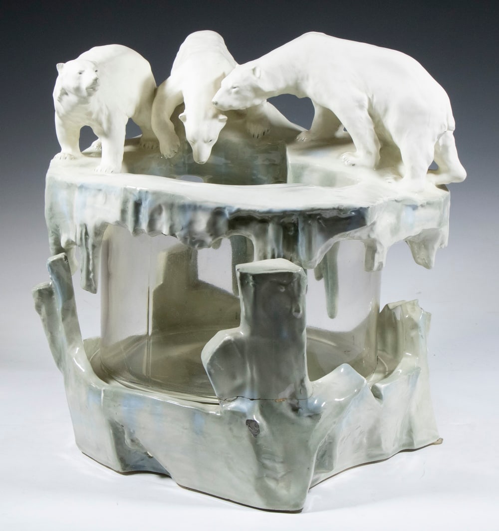 AUSTRIAN POLAR BEAR FISH BOWL: Early 20th c. Ceramic and Glass Fish Bowl, in three sections, top is signed "F. Makowicka", base with medallion marked "Vienna Faience", 14" high, 13" x 12". Repaired ceramic breaks; glass crack with 