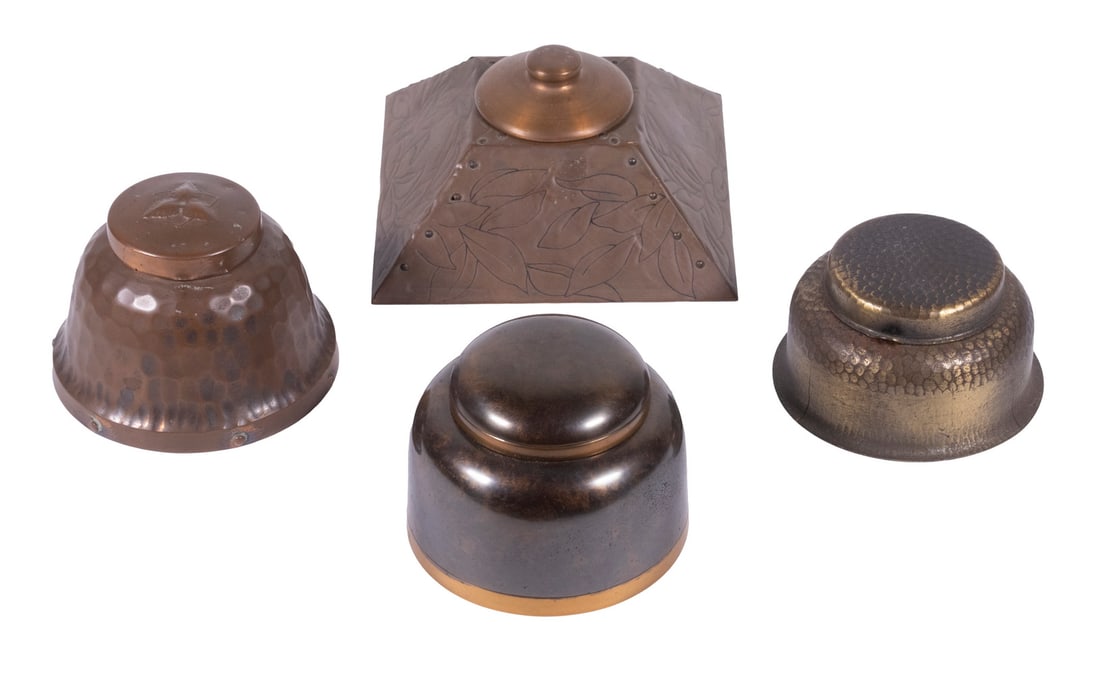 ARTS & CRAFTS PERIOD COPPER INKWELLS: Lot of (4) 1900-1920 American Made Inkwells, incl: Craftsman Studios (Laguna Beach, CA) hammered copper inkwell, with embossed lid, glass liner, 2 1/2" high, 3 1/2" diam.; Silvercrest Bronze inkwell,