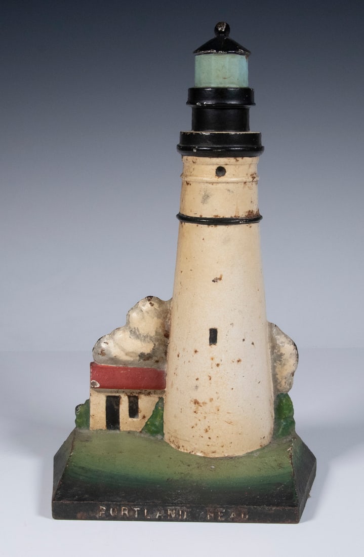 PORTLAND HEAD LIGHTHOUSE IRON DOORSTOP: Vintage Painted Cast Iron Doorstop, depicting Portland, Maine's iconic lighthouse, stamped "1986 WAB, Original Lighthouse Collection, 10" high, 6" x 3".