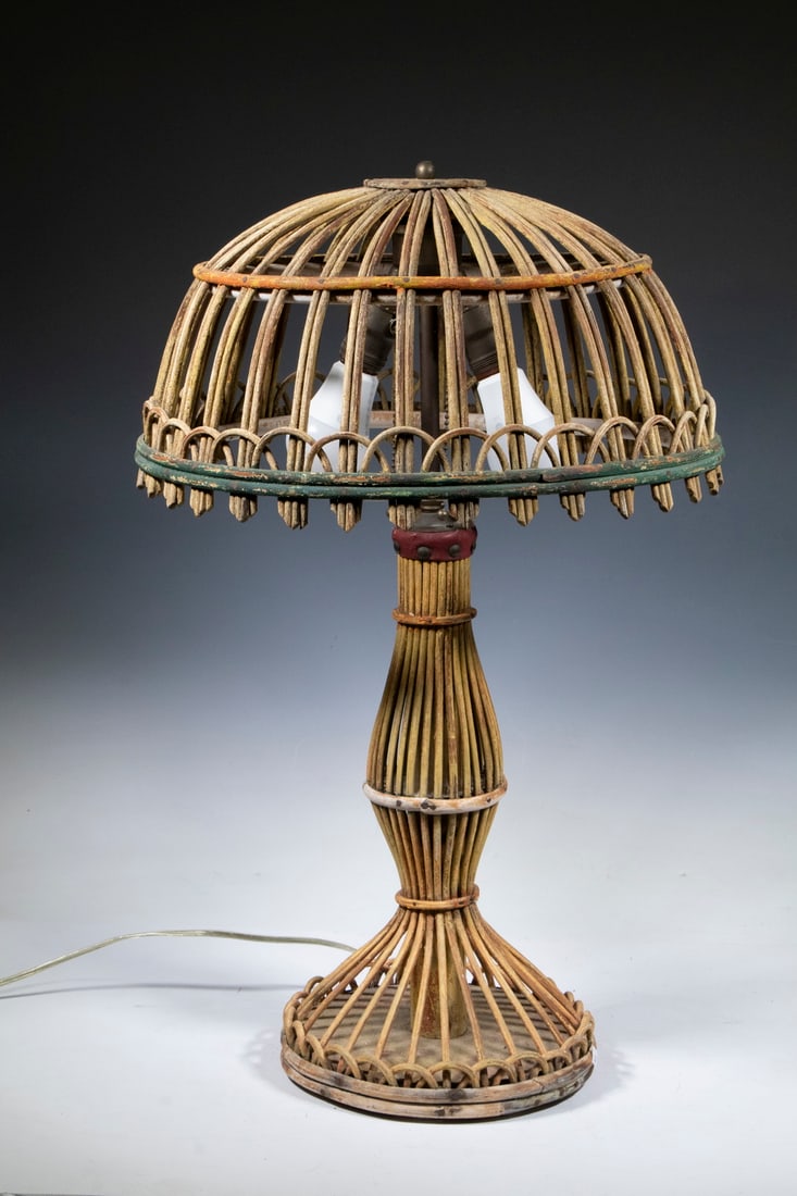 VINTAGE RATTAN TABLE LAMP: Circa 1920s Lamp, with dome form shade and baluster shape base, two-socket fixture with chain pulls, 25 1/2" high, 16" diam.