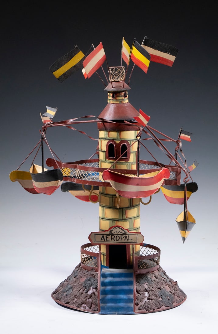 VINTAGE FRENCH TIN "AEROPAL" CAROUSEL TOY: Hand Crafted Painted Tin Toy, mid-20th c., after an early 20th c. similar revolving toy by Marklin, with six suspended gondolas, 17" high, 12" diam.