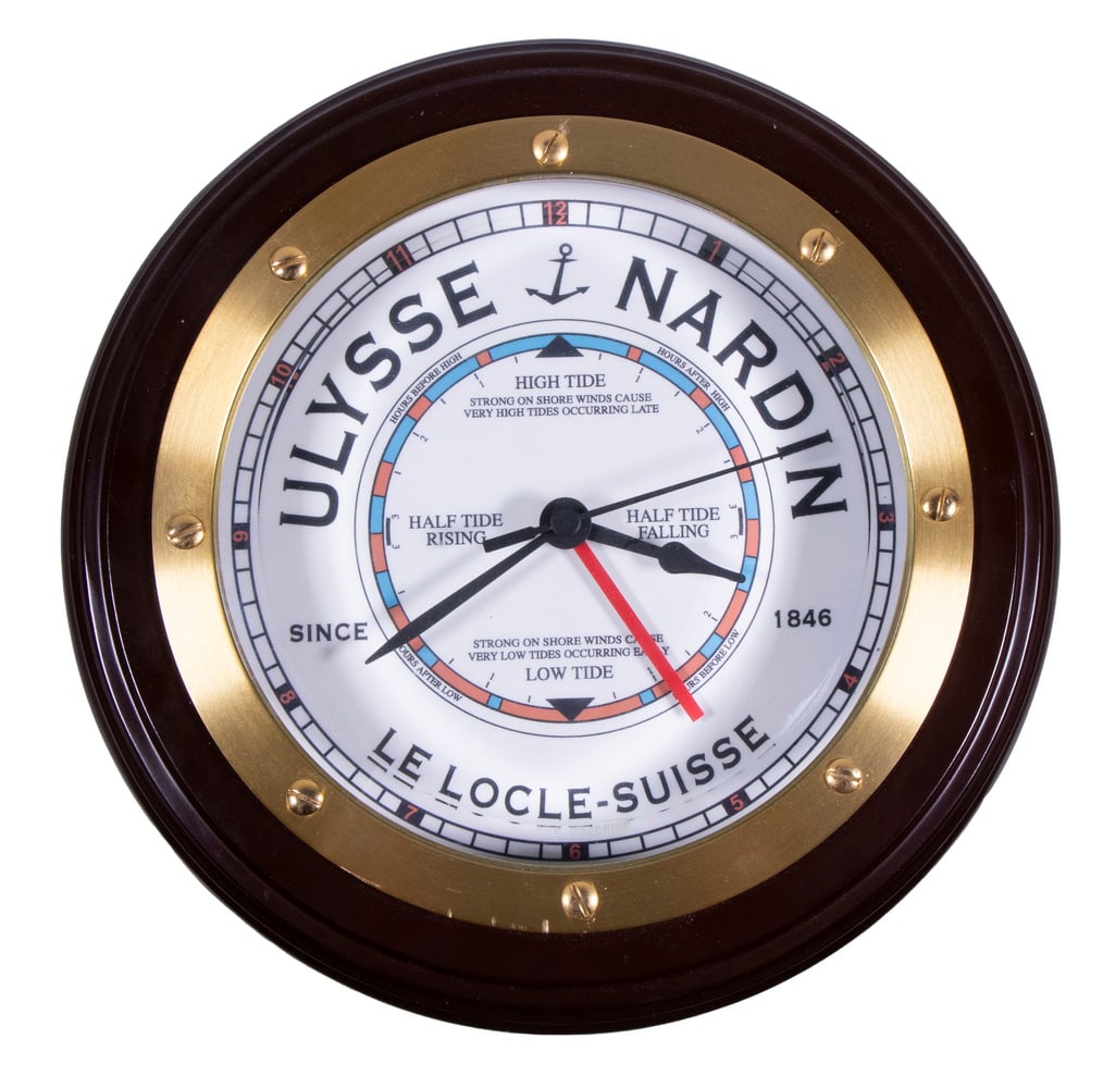 ULYSSE NARDIN TIME & TIDE WALL CLOCK: Swiss Made Nautical Clock, that tells the time and local tide cycle, having a brass bezel and beveled glass cover, face marked "Ulysse Nardin, Since 1846, Le Locle - Suisse" , AA battery operated, bat