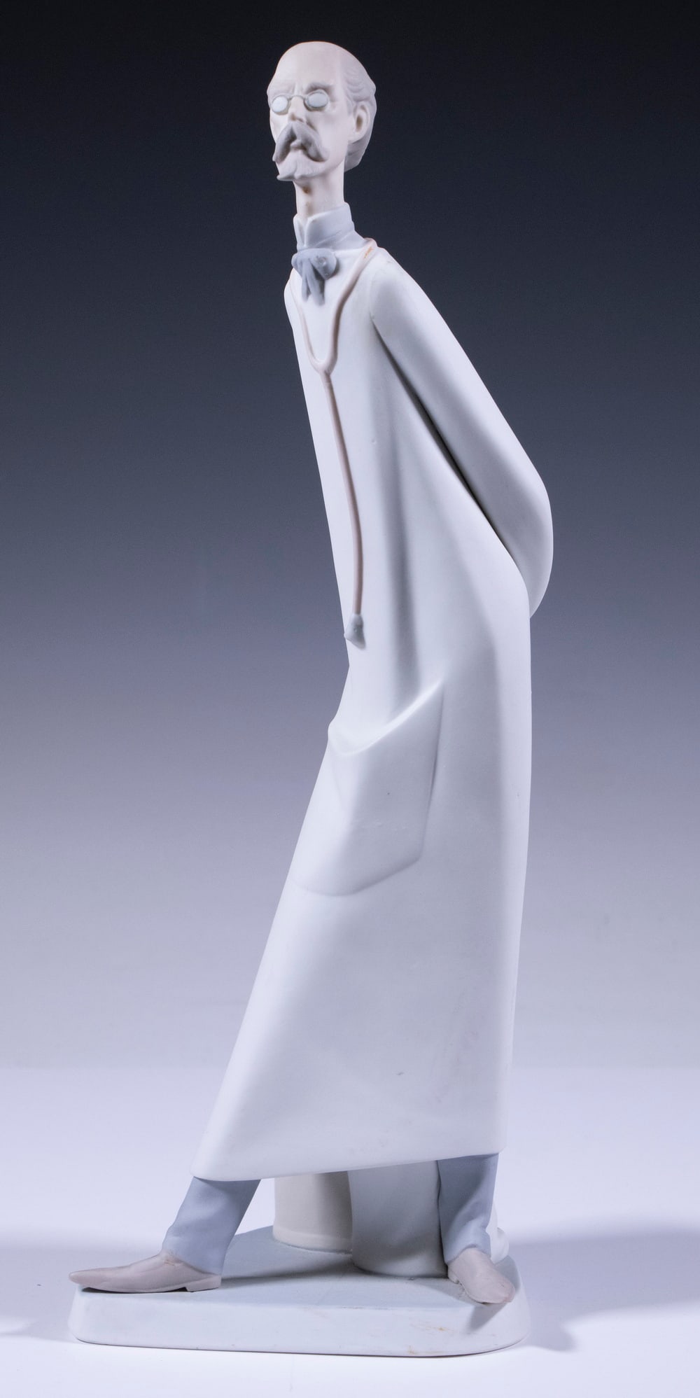 LLADRO PORCELAIN DOCTOR FIGURINE: Spanish Handmade Bisque Porcelain Figure by Lladro, depicting a standing doctor, #4602, circa 1972, with third Lladro backstamp on base, 14" high.