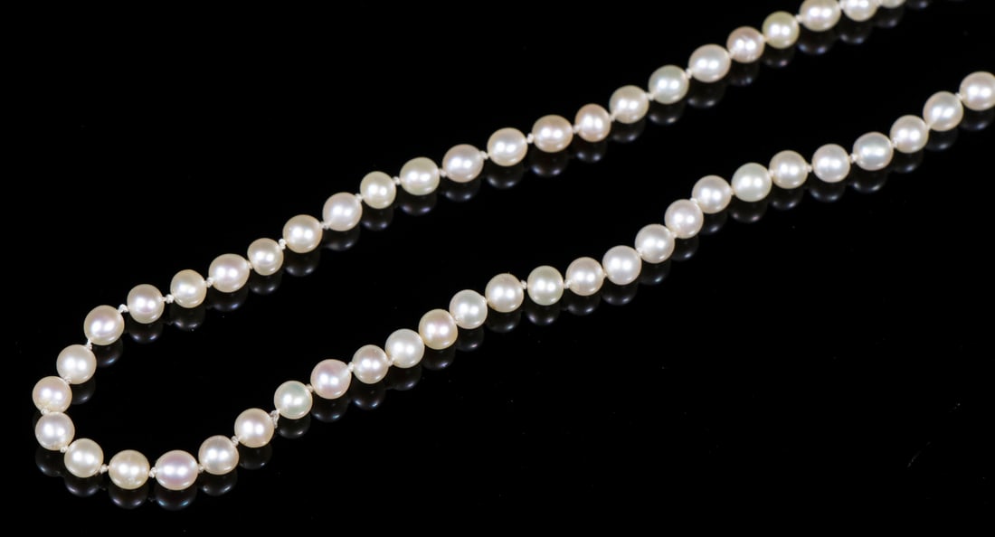 PETITE PEARL NECKLACE: Single Strand of 2mm Pearls, with a tiny diamond set clasp, 17 1/2" long.