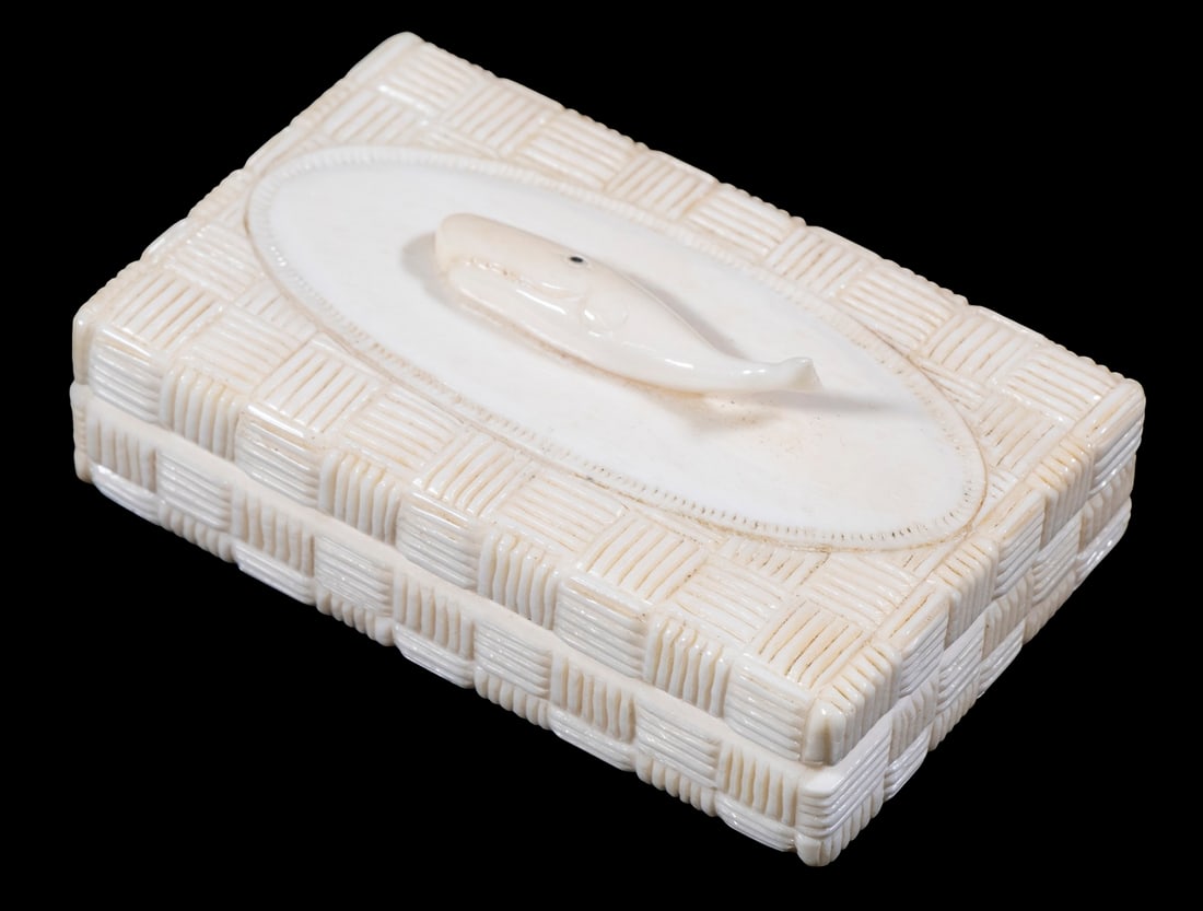 SMALL MARITIME IVORY BOX: Right Whale decorated box with hinged lid bearing a right whale, having an oval plaque over basket weave carving on all sides, probably for matches, 1 1/2" x 3 1/2" x 2 1/4", shrinkage crack to bottom