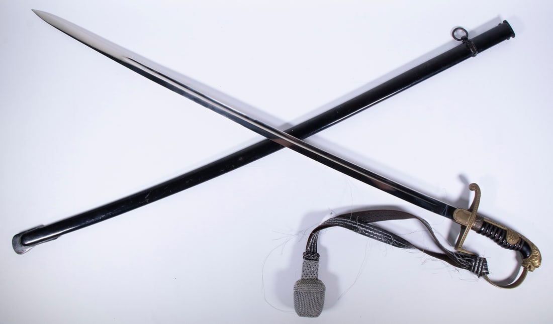 WWII WEHRMACHT LION'S HEAD SWORD: An excellent example of the Lion's Head sword issued to high-ranking officers of the German Wehrmacht during World War II. The sword features a 30" long saber blade marked "Anton Wingen Jr., Solingen"