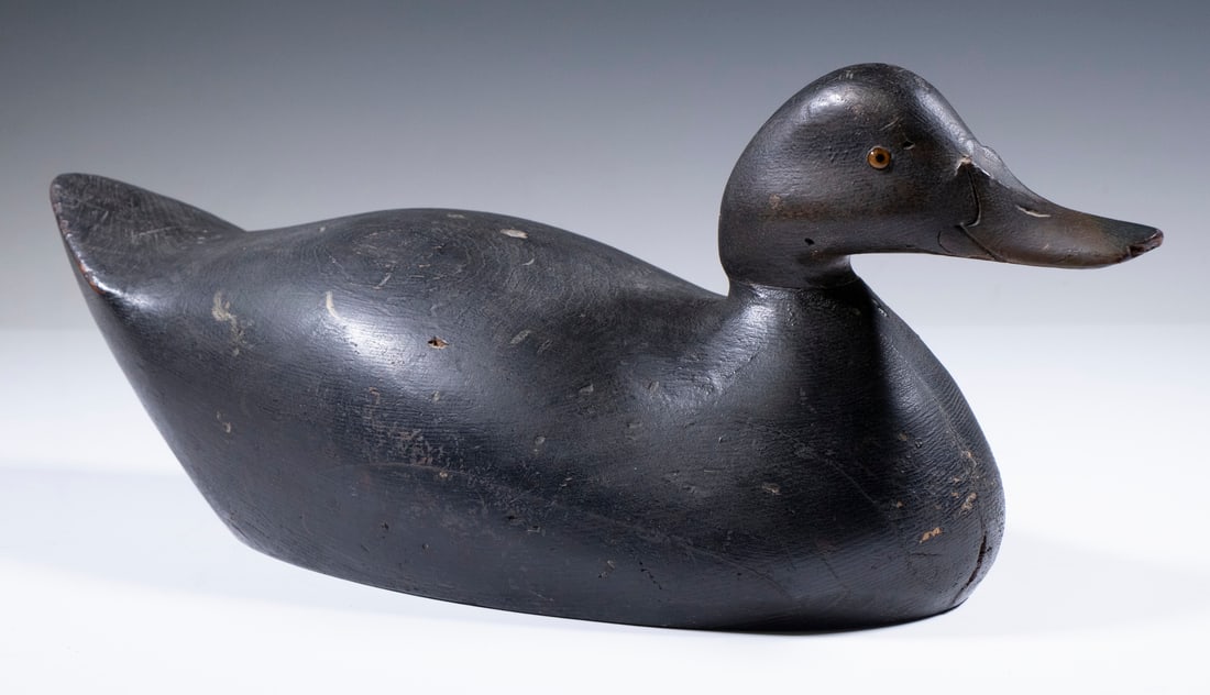 BLACK DUCK DECOY: Early Oversize Premier Mason Black Duck; the body appears to be original paint; the bottom has been sanded smooth and touched up, 7" high, 17" long.