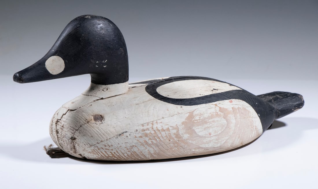 GOLDENEYE DUCK DECOY: Nova Scotia Goldeneye Drake, most likely by a member of the Levi family, in a mix of in-use and original paint; overall, a nice bird, 6" high, 14 1/2" long.