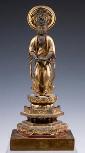 19TH C. JAPANESE STATUE OF BODHISATTVA: Edo goddess of mercy Kannon (Juichimen Kannon), in carved gilt wood with metal crown and necklace, halo on stem, hands clasped held out in front of waist (missing staff), standing on three tiered lotu