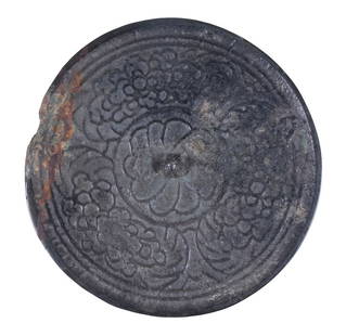 JAPANESE BRONZE MIRROR, MOMOYAMA PERIOD: Round Hand Mirror, ca. 1568-1615, with raised decoration depicting the crest of the Emperor of Japan, pierced central boss, 4 3/4" diam. Minor edge loss.