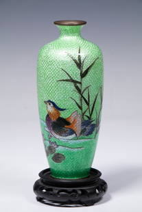 JAPANESE CLOISONNE VASE: Baluster Shape Foiled Enamel on Brass Vase, in green, depicting a quail amid aquatic plants, 7" high; on carved wooden stand.
