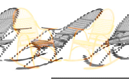 PR VERMONT TUBBS SNOWSHOE FORM ROCKING CHAIRS: Pair of Vintage Rockers, having oak bentwood frames with woven rawhide lacing to seats and backrests, unsigned. Converted dimensions: 37 x 20 3/4 x 33 in. (94 x 52.7 x 83.8 cm.)