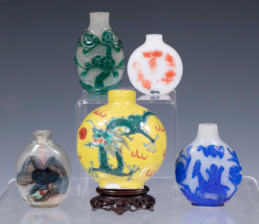 (5) CHINESE SNUFF BOTTLES: Collection of (5) Snuff Bottles, incl: (1) Moon flask shaped porcelain snuff bottle with front and back decoration of dragon chasing a pearl on Imperial yellow ground, with carved wooden stand, 2 3/4"