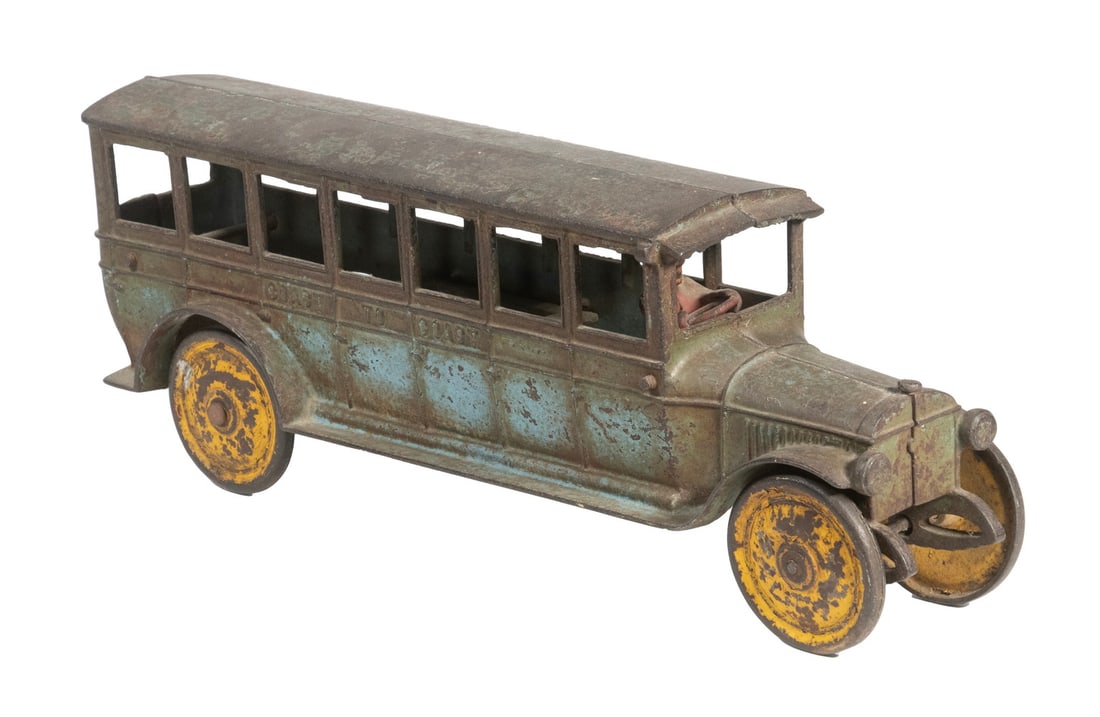 DENT CAST IRON "COAST TO COAST" TOY BUS (1 of 4)