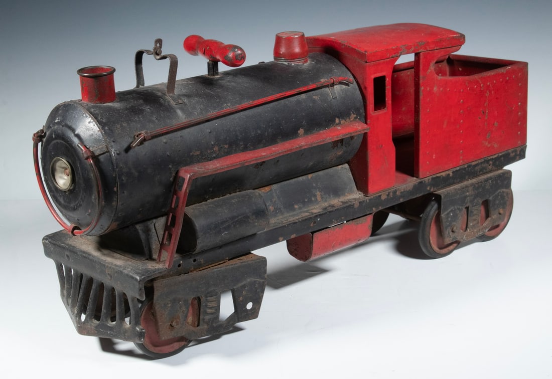 KEYSTONE RR6400 RIDE ON TOY LOCOMOTIVE: Sturdy Riding Toy in cold pressed heavy steel, red and black paint, black rubber tires, wear from use, light corrosion.From the private collection of Sally Jessy Raphael Converted dimensions: 13 x 25 
