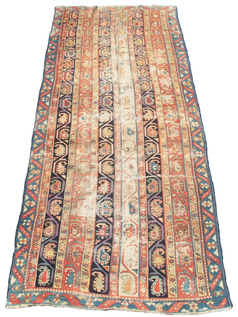 KAZAK LONG RUG (3'9" X 9'3"): Southwest Caucasus make, early 20th C. vertical stripes inset with botehs in midnight blue, ivory, rust, gold, tan, and sky blue. Rust diamond motif border. Extensive wear. Converted dimensions: 45 x