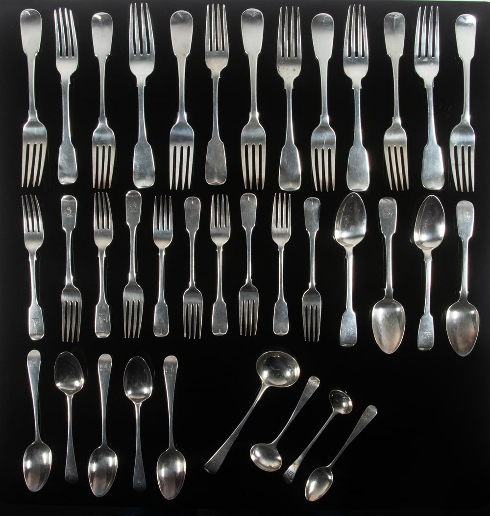 (43 PCS) IRISH & ENGLISH STERLING FLATWARE WITH LION CREST: (43) Piece Collection of Forks and Spoons, Georgian and Victorian eras, all pieces with engraved demi-lion crest, incl: (16) Heavy dinner forks, eleven by Stephen Bergin, Dublin, 1820-21, three by Jam