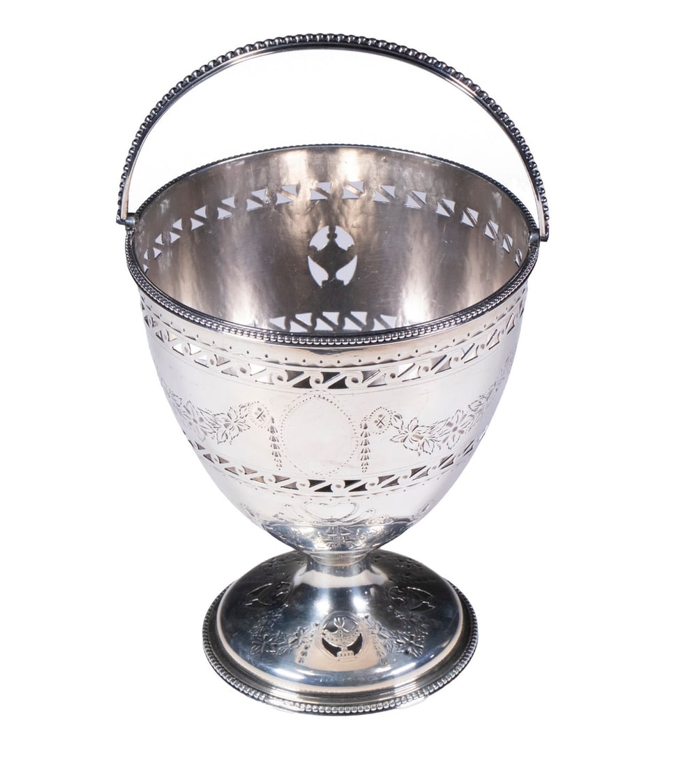 GEORGE III STERLING SUGAR BASKET BY ROBERT HENNELL I: English Silver Footed Basket by silversmith Robert Hennell I, hallmarked for London, 1783, with beaded edge swing handle, top and base rim; the body and foot with reticulated and chased decoration; 5
