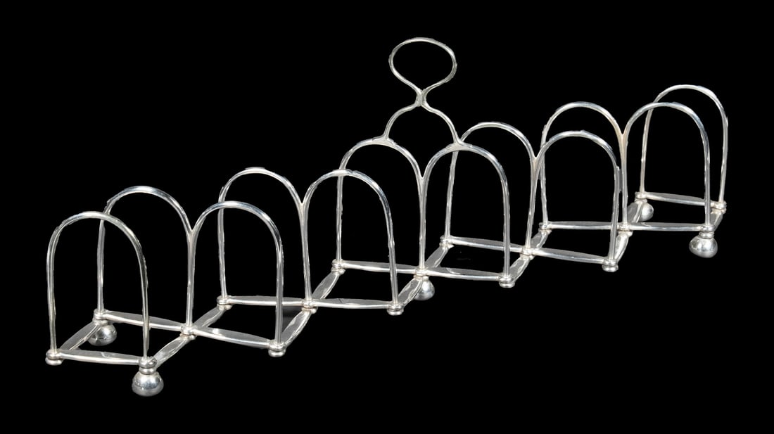 ENGLISH SILVER-PLATE EXPANDING TOAST RACK - LETTER HOLDER: Unusual 19th c. Concertina Design Expandable Rack, in silver-plate by John Gilbert & Co. (Birmingham & London), with top handle and five ball form feet. Converted dimensions: Closed: 5 1/2 x 2 1/2 in.