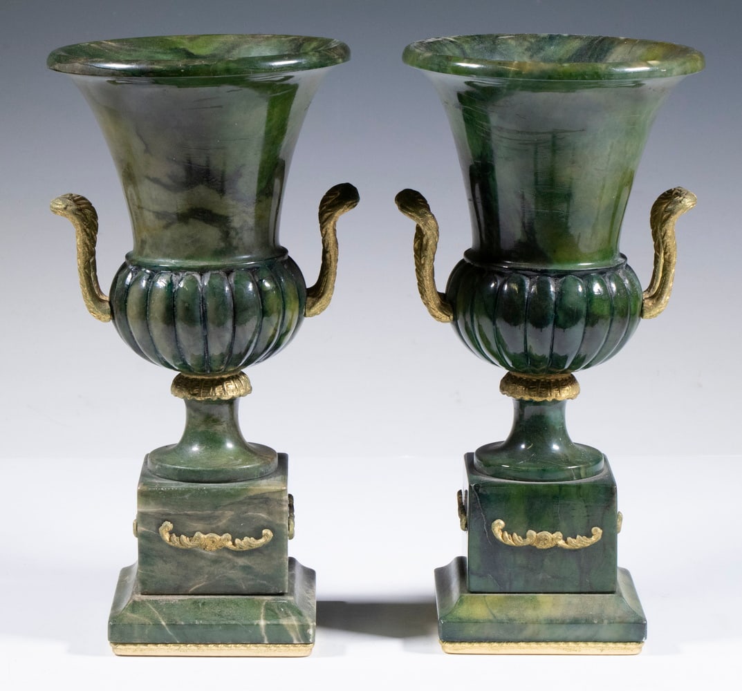 PR BRASS MOUNTED CARVED STONE URNS: Pair of Campagna Form Urns, in carved green marble, with gilded brass side handles, each with small hole at base edge.From the Estate of Bowdoin Professor William Collins Watterson. Converted dimensio
