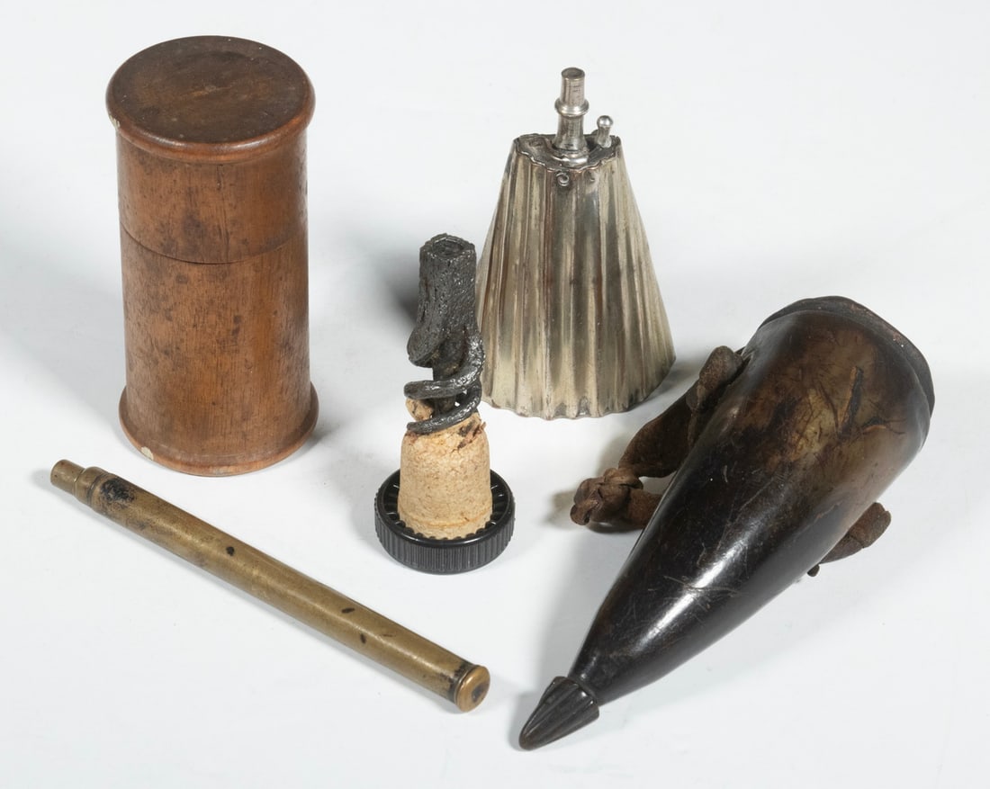 (4) ANTIQUE FIREARM ACCESSORIES: A lot of historical shooting equipment. Included are a small metal powder flask, a cylindrical priming tool, a horn purse, and a musket worm. The powder flask is a more ornate design with a ribbed, po