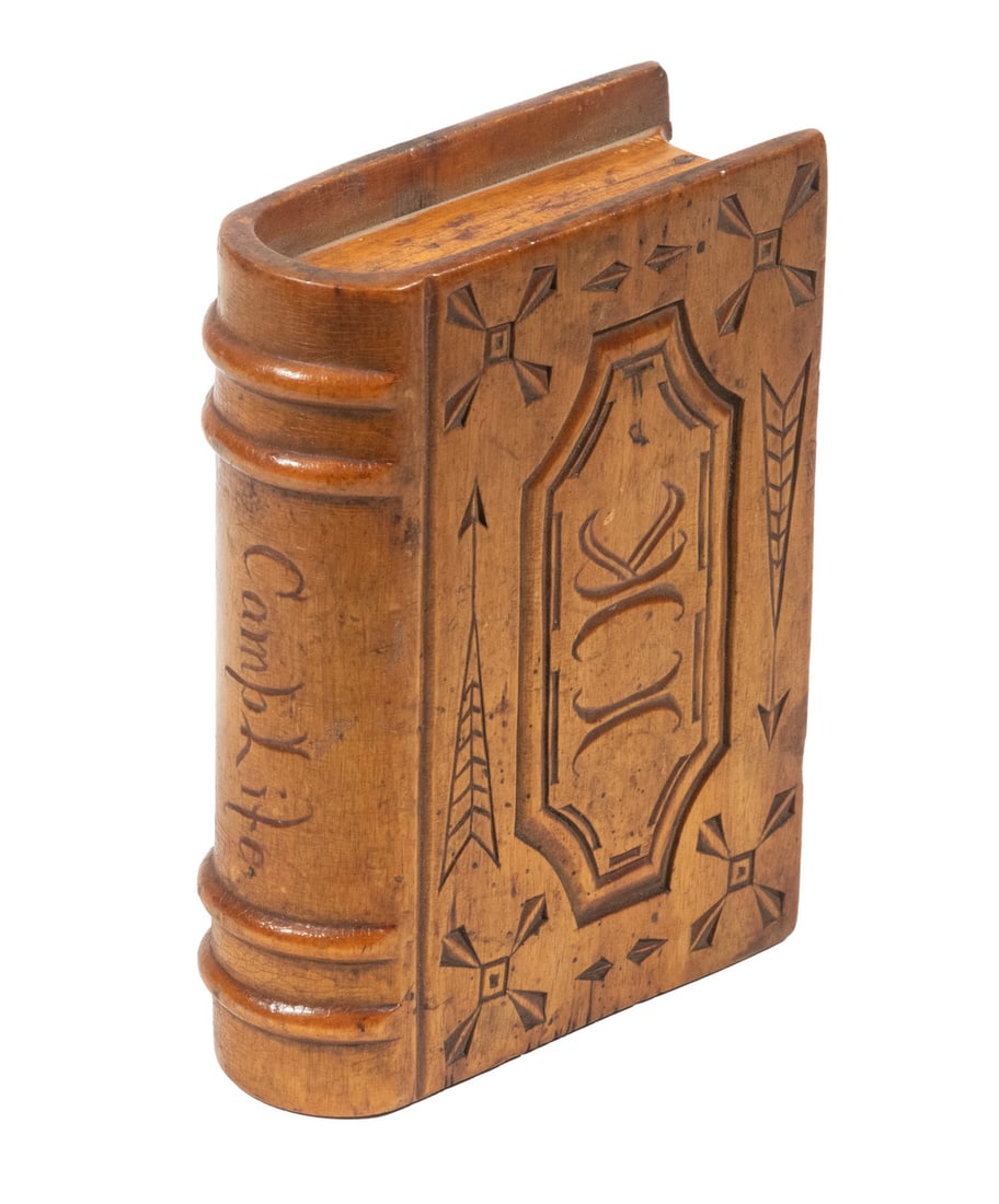 FOLK ART CARVED SPRUCE GUM BOX: 19th c. Book Form Box, hand carved with geometric motifs, IK monogram, and titled "Camp Life", the bottom "pages" comprising a sliding lid, 5" high, 3 1/2" x 1 1/2". Converted dimensions: 5 x 3 1/2 x