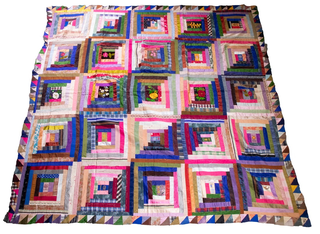 SILK PATCHWORK QUILT TOP: Early 20th c. Hand Stitched Log Cabin Design Quilt Top, consisting of tie remnants and tobacco silks, with top basting stitches, cotton backing, 78" x 78". Minor losses. Converted dimensions: 78 x 78