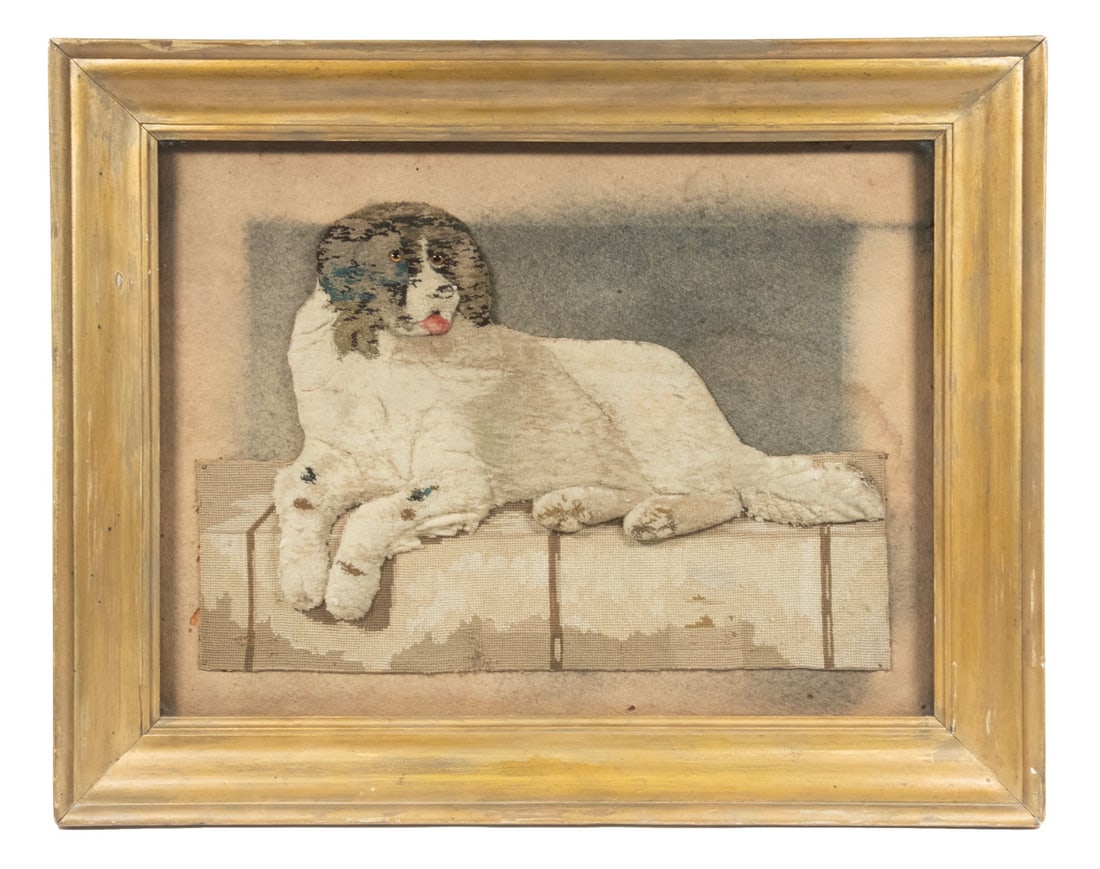 FRAMED ENGLISH WOOLWORK OF DOG: 19th c. Trapunto Woolwork Picture, depicting a recumbent St. Bernard with glass eyes on a needlepoint perch, mounted on a felt background, in a gold painted shadowbox form frame, glazed. Converted dim