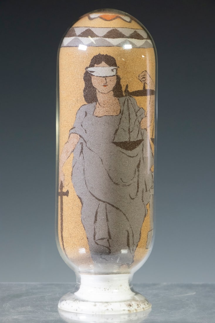 DESERT OF MAINE "LADY OF JUSTICE" SAND ART CAPSULE: Circa 1965 Finely Crafted Sand Art Bottle, depicting Lady Justice and a court building, a one-of-kind creation by Judy Goldrup (daughter of the original owner of the Desert of Maine, Henry M. Goldrup,