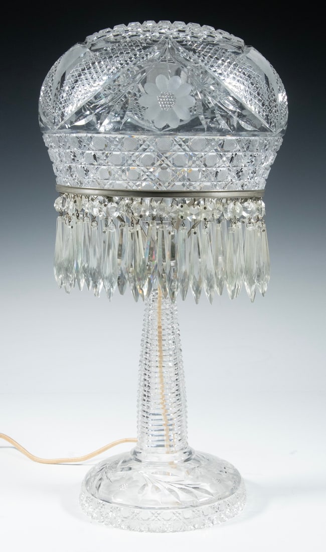 AMERICAN BRILLIANT CUT GLASS TABLE LAMP: ABCG Lamp, having a mushroom shade with cane, fan, floral and crosshatching decoration, drop prisms below shade support ring, set on a base with ring turned, floral and cane decoration, 19 1/2" high, 