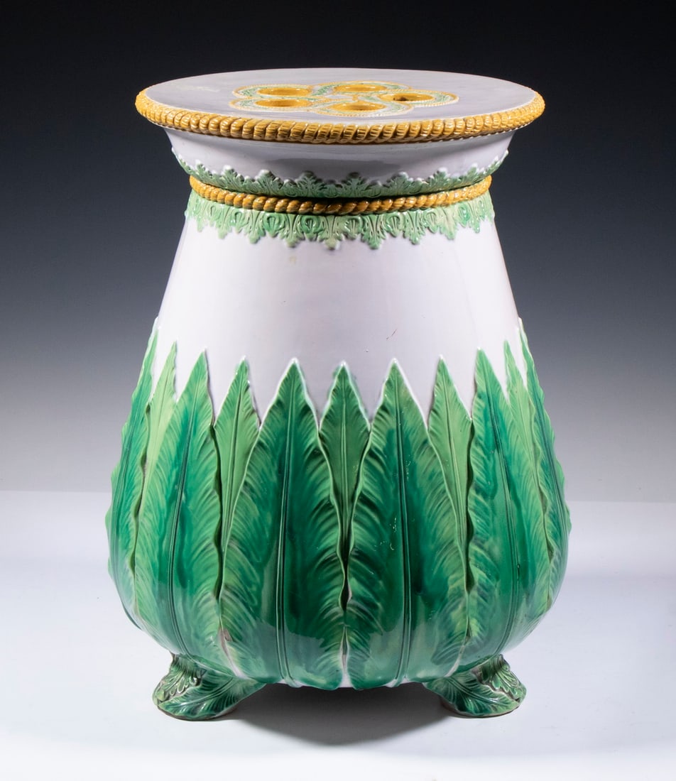 GEORGE JONES VICTORIAN MAJOLICA GARDEN SEAT: Circa 1875 English Glazed Pottery Garden Stool in a raised acanthus or fern leaf design, having a white ground with pierced top, molded rope motif edging, set on leaf decorated feet, with George Jones