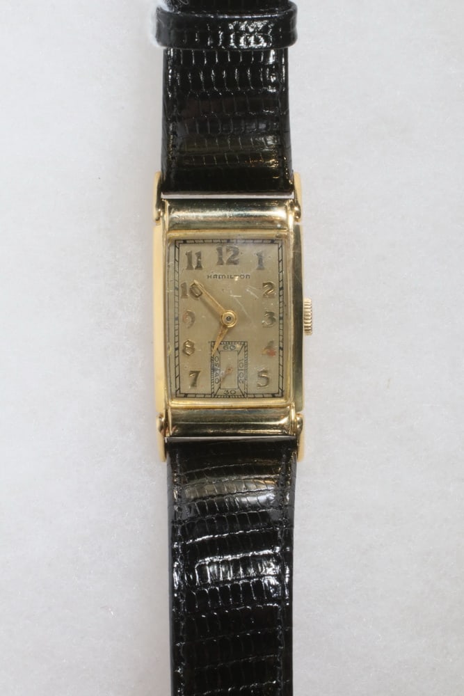 VINTAGE HAMILTON 14K GOLD GENT'S WRISTWATCH: Vintage Hamilton Tank Form Wristwatch with yellow gold square head, marked '14K' to case back. Recently serviced, with new embossed black leather band. Light scratch on crystal.