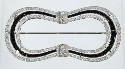 ART DECO DIAMOND, ONYX AND PLATINUM BROOCH