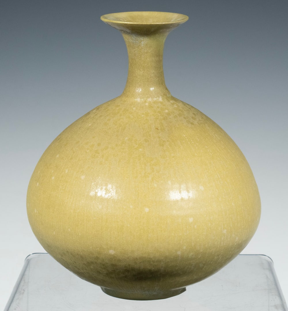 LAURA ANDRESON (CA, 1902-1999) ART POTTERY VASE, 1976: American Studio Bulbous Porcelain Vase, with yellowish green glazed surface with blue drip overglaze, incised signature and dated '76 on blue glazed base, 6" high, 5" diameter. From the private collec