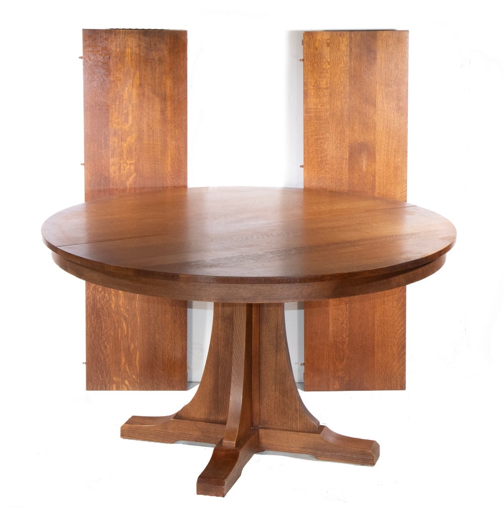 STICKLEY ROUND OAK PEDESTAL DINING TABLE WITH LEAVES: Mission Style Solid Oak Table, with two extra leaves, #89-713, by Stickley (Manlius, NY and Archdale, NC), maker's marks on underside, 30" high, 52" diam., 15" wide leaves. Converted dimensions: 30 x