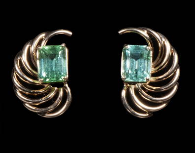 PR 14K GOLD AND TOURMALINE EARRINGS: Each featuring a rectangular step cut pale green tourmaline mounted in a sculptural yellow gold spiral form setting with omega back, stamped "14K", each size 7/8" x 1/2"; 3.7 dwt. tw. Good condition.