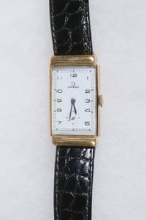 VINTAGE 14K GOLD GENT'S WRISTWATCH, OMEGA: Omega Vintage Tank Form Wristwatch with 14K yellow gold square head. Recently serviced, with new embossed black leather band. Dimensions