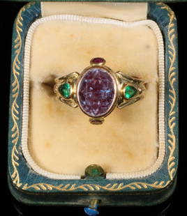 14K YELLOW GOLD, ALEXANDRITE AND EMERALD LADY'S RING: Custom Designer Ring in 14K yellow gold with oval alexandrite center stone, (2) small bezel set garnets and (2) pear shaped emeralds on band, stamped "DCD", size 7 1/2, in box. Dimensions Size: 7 1/2
