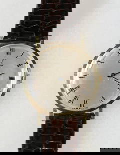 OMEGA 14K GOLD GENT'S WRISTWATCH: Omega Wristwatch with round head in yellow gold, marked '14K' to case back, with brown lizard band, recently serviced. Dimensions