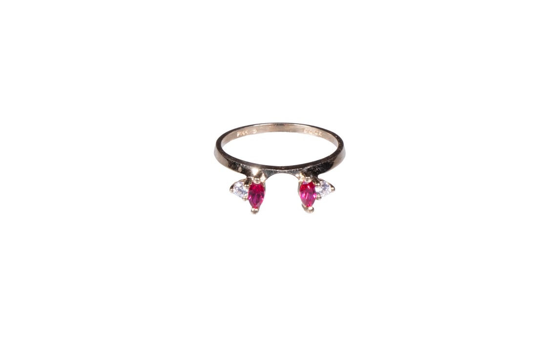 14K GOLD AND SPINEL RING GUARD: Crafted in 14K Gold, set with marquise shaped red spinel flanked by round cubic zirconia on each side; size 8; 1.5dwt. tw. Good condition. Dimensions Ring Size: 8
