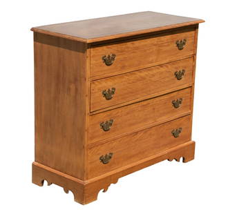 COUNTRY CHIPPENDALE FOUR-DRAWER BIRCH CHEST: Simple Country Chest in flame figured birch, having molded overhanging top, four drawers with replacement brasses, raised on plain bracket base.From the estate of Brooke Astor at her summer residence