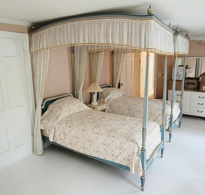 PAIR OF SISTER PARISH PAINTED TWIN SIZE WOOD CANOPY BEDS, AMERICAN, C. 1940s–1960s