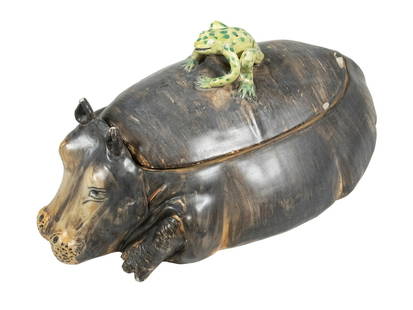 MID-CENTURY HAND-MADE HIPPOPOTAMUS TUREEN WITH FROG FINIAL, A.G., ITALY: A whimsical hand-painted ceramic tureen in the form of a reclining hippopotamus, the lid adorned with a green frog finial. Marked &#8220;A.G.&#8221; beneath a crown symbol and inscribed &#8220;Hand Ma