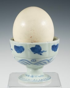 OSTRICH EGG WITH BLUE AND WHITE PORCELAIN STAND