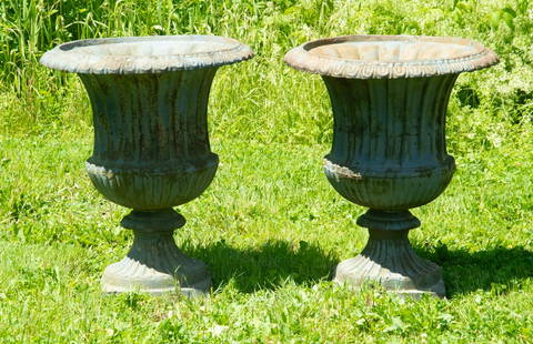 LARGE PAIR EARLY CAST IRON GARDEN URNS: Architectural Scale Cast Iron Greek Urns with fluted sides and lappet rim, on molded square base. Remnants of green paint. Each: 27 x 21 x 21 in. (68.6 x 53.3 x 53.3 cm.)