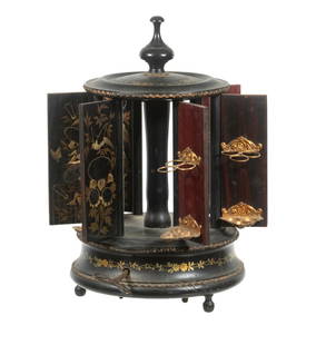 ANTIQUE FRENCH MUSICAL JAPONESQUE CIGAR CAROUSEL WITH SWISS MOVEMENT: A rare rotating 19th century musical cigar carousel with six hinged doors, each decorated in gilt Japonesque style. Doors open and close automatically as music plays. Interior fitted with brass cigar