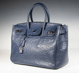 HERMES DARK BLUE OSTRICH BIRKIN BAG WITH PALLADIUM: French Made Birkin Handbag by Hermes, in deep blue ostrich leather, with rolled handles, palladium hardware with turn-lock front closure, leather lined interior with one zip and one open pocket, with