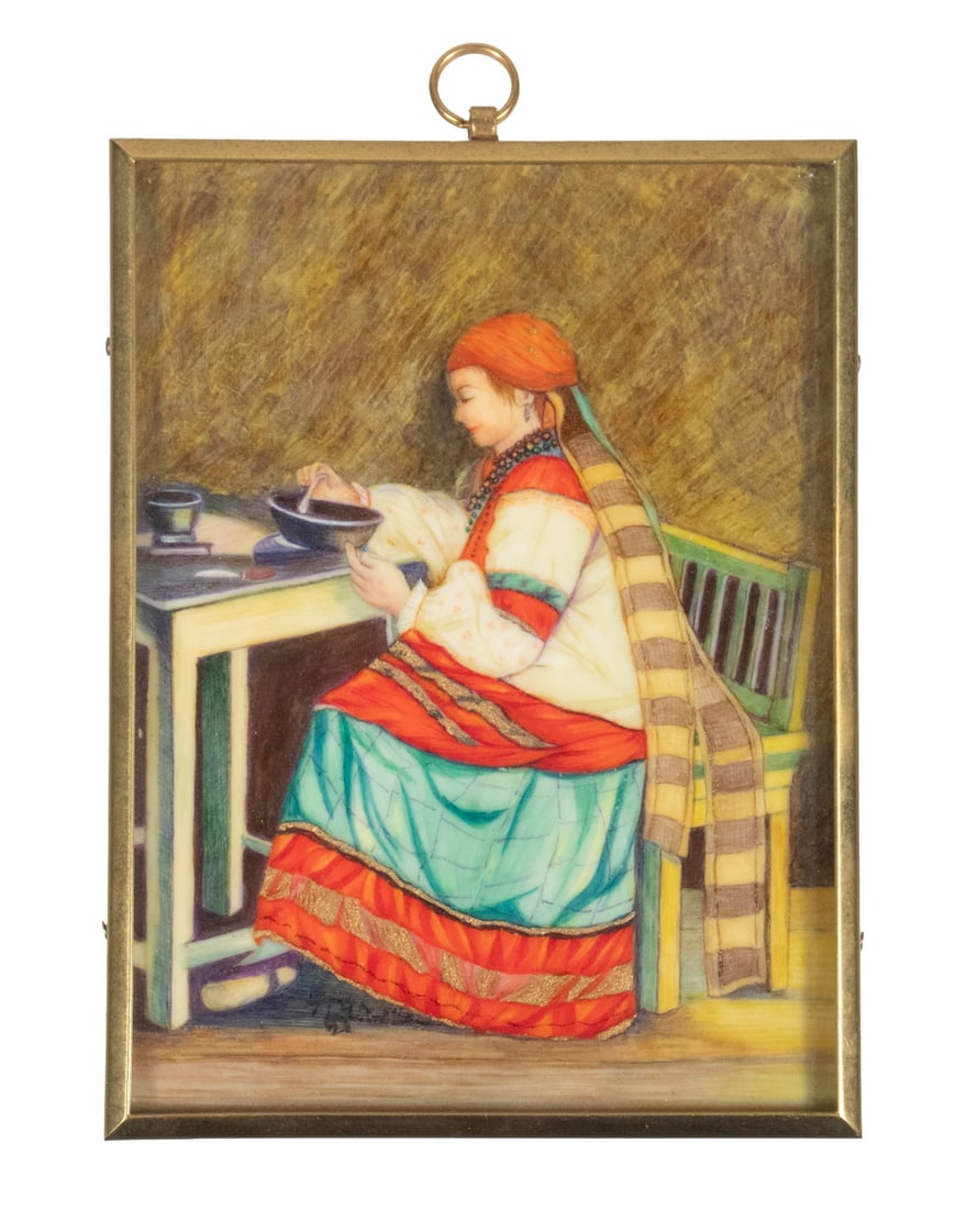 MINIATURE GREEK IVORY PAINTING: Woman in Ethnic Costume, seated on bench while dining, oil on ivory, unsigned, brass frame with domed glass. 4 x 3 in. (10.2 x 7.6 cm.)