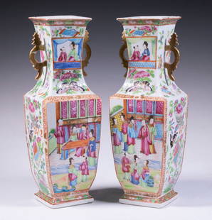 PR CHINESE ROSE MANDARIN VASES: Pair of 19th c. Porcelain Vases, square baluster form with gilt side handles, with paneled figural decoration surrounded by floral and auspicious symbol motifs. One with repaired brakes. OS: 12 1/2 x